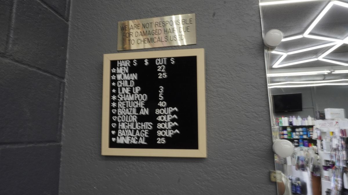 Services and pricing board at Sebastian Barber Beauty Salon